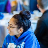 Alumni smiling for a photo